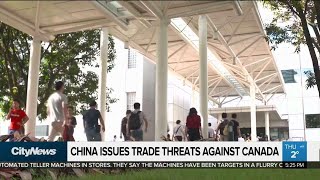 China issues trade threats against Canada...