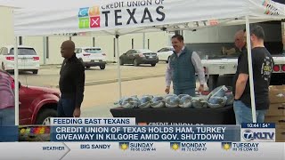 Credit Union of Texas holds ham turkey giveaway in Kilgore