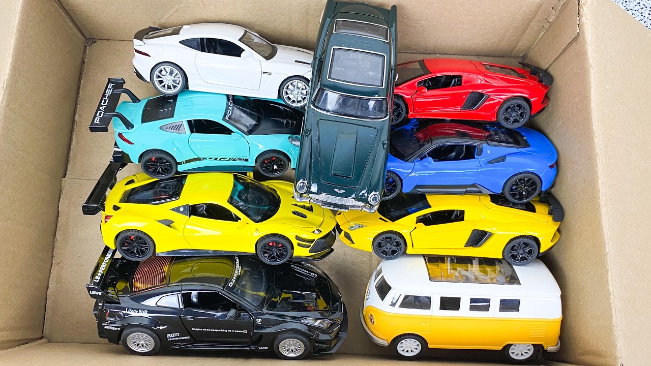 Box Full of Model Cars -Tesla Robotaxi, Tesla Cybertruck, Tesla Roadster, Lexus LC500, Lexus Lm 300h