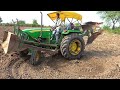 John Deere 5050E levelling with Front Dozer and 2MB Revasibal Plough