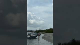 Waterspout Touches Down on Beach and Kicks Up Sand