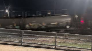 Two CSX locomotives lead a BIG nb mixed freight across Blount Street in Fayetteville 8/12/2026