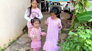 cute baby chhi chinh inh they are picking the flowers at home