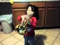Cute little girl playing the trumpet