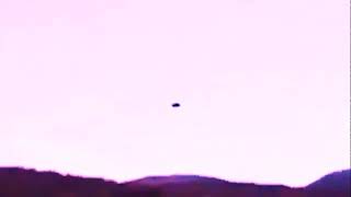 SAUCER UFO FILMED FROM TRAIN