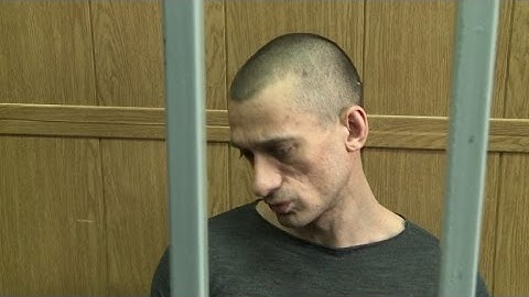 Russian artist on trial for torching security service HQ door