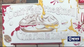 'Let me finish my project, please.': Salina restaurant owner pauses mural project after city orde...