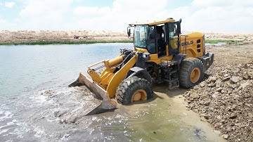 Invincible Skills Operator Strong Power Wheel Loader Spreading Rock Soil Into Water New Road Build