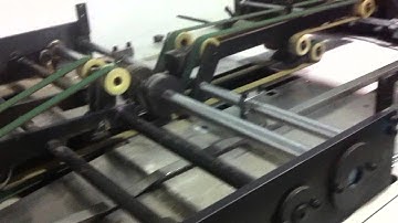 Calendar hole punching machine for wire o and spiral production