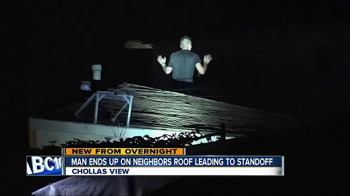 Man arrested after standoff on roof of home