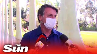 Brazil's President Bolsonaro removes mask next to press as he confirms positive coronavirus result
