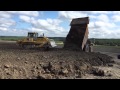 Komatsu D85 PX Spreading dirt from Cat 775 and Komatsu HD605