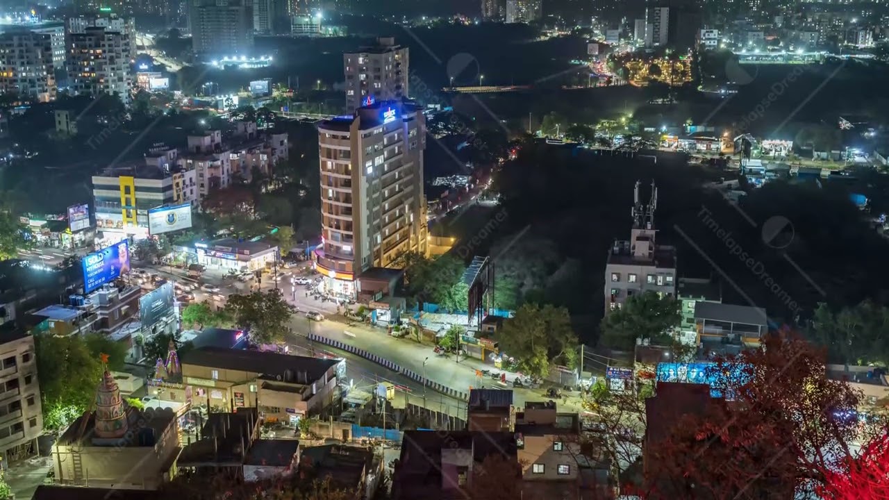 Aerial cityscape view and Time lapse of Night traffic on the streets of City of Pune, India