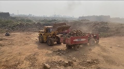 Heavy Equipment in Action | CAT Machine Loading Giant Rocks