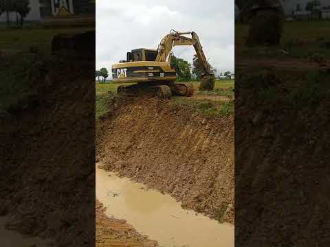 Excavator CAT & Driver Are Digging Mud In Canal #196