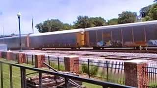 CSX 5364 and CSX 372 leads and autorack, empty well car train past The Dalton Depot