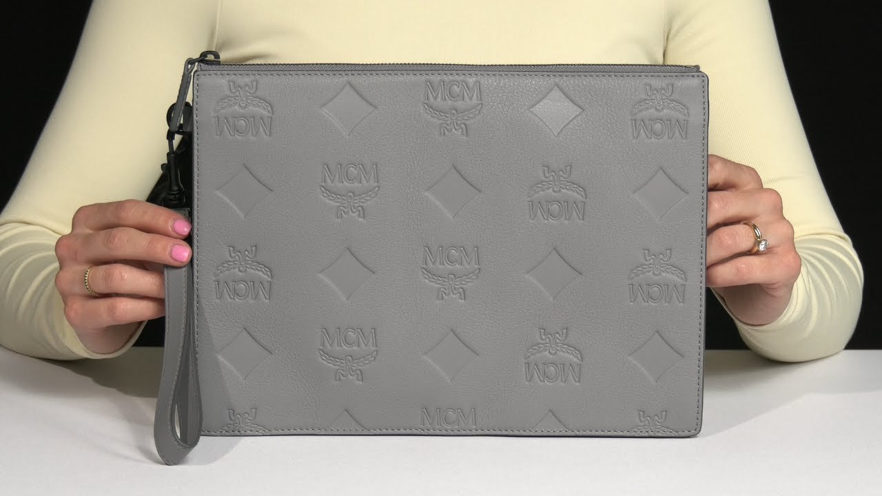 MCM Aren Emblem Maxi Monogrammed Leather Flat Pouch SKU: 9926679