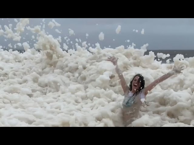 Sea foam swamps Australian beaches amid spell of extreme weather