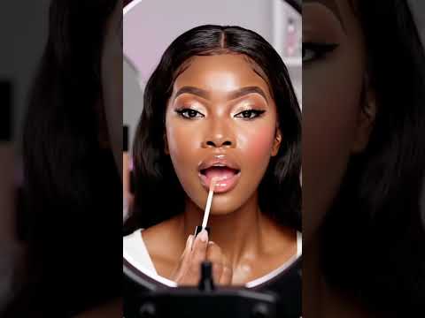 A young beautiful woman in a modern beauty studio showing a viral makeup transformation.