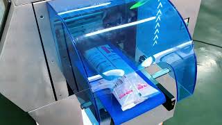 Gloves packaging machine flow wrap packer
