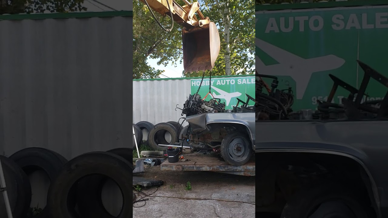 Who needs a motor hoist when you got a backhoe!