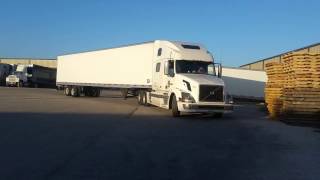 How to back up a semi truck.  Woman truck driver backing up semi truck.