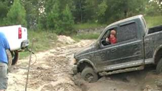 chevy silverado pullin ford out the mud