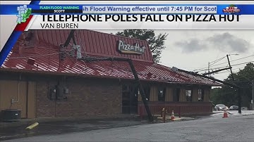 Two telephone poles crash onto local restaurant