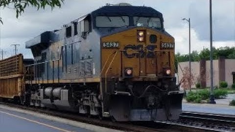 [CSXT]5437 ES40DC Solo Leads Fully Loaded W957-09 MOW Cross Tie Gondola W/Backhoe-Train NB In Fay NC