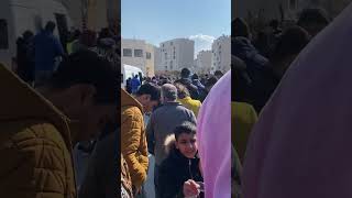 People Forming Lines in an Earthquake Zone to Receive Relief Meals
