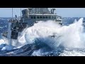MILITARY SHIPS NATO ARMY ARE SAILING ON LARGE WAVES IN STORM TO PROTECT EUROPE