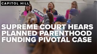 Supreme Court hears pivotal case on Planned Parenthood funding as activists rally outside