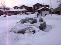 Audi A4 pulling out of driveway with snow up to the windows!