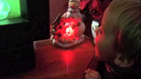 Jayden blowing out a fake candle