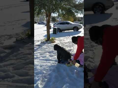 Abigail and Joseph sledding