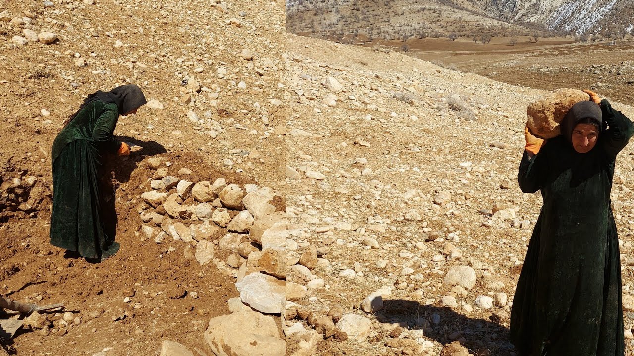 Stone by stone, Asiya builds a wall of hope to protect her hut from the fury of winter.