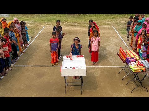 Village Boys And Girls Rolling The Ball To Win There Favorite Food Items 