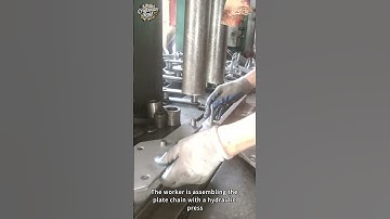 The worker is assembling the plate chain with a hydraulic press