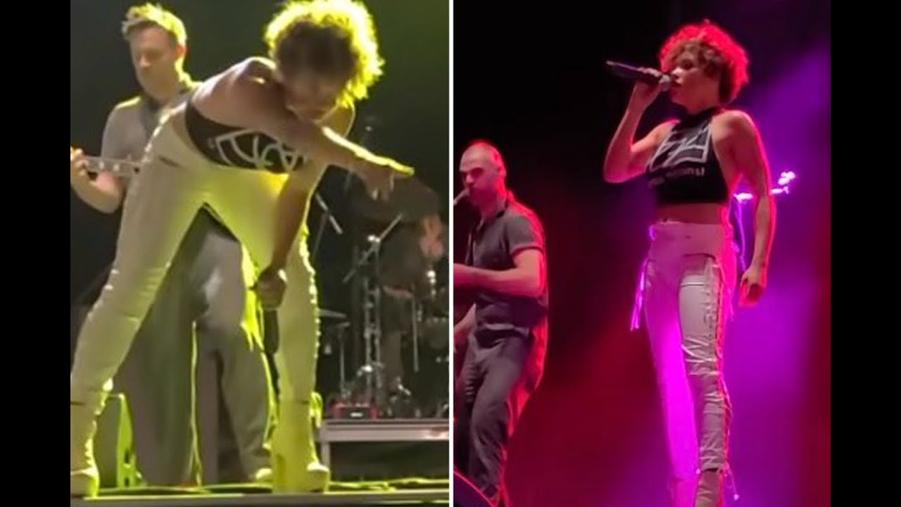 Rock band singer pulls down her pants and PEES on fan during concert - YouT...