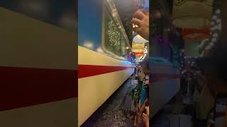 People in the Railway Market Cheering as the Train Approaches