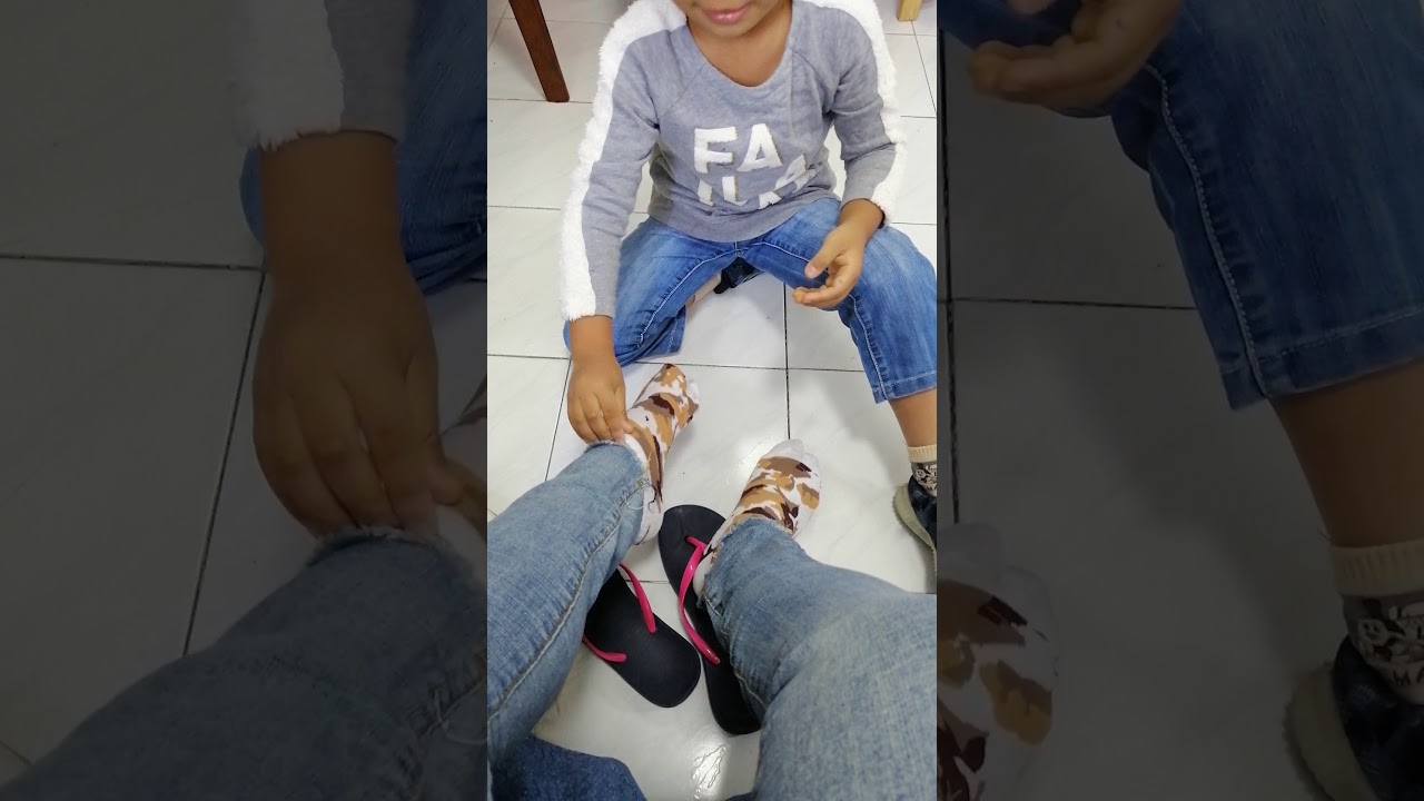 Sweet Boy Helping Mom Wear Shoes