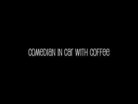 Comedian in Car with Coffee
