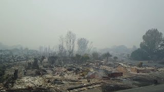 Drone video shows wildfire devastation ...