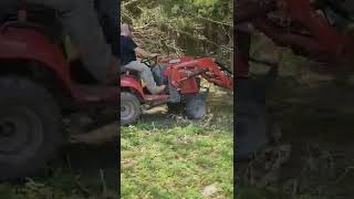 Massey Ferguson turning dirt