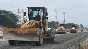 Amazing motor grader making a road outflow skilled operator and roller