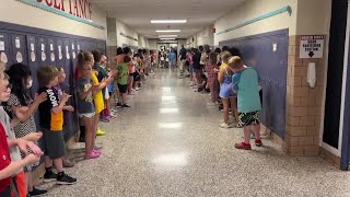 Video: Auburn high grads parade hallways of their former elementary schools