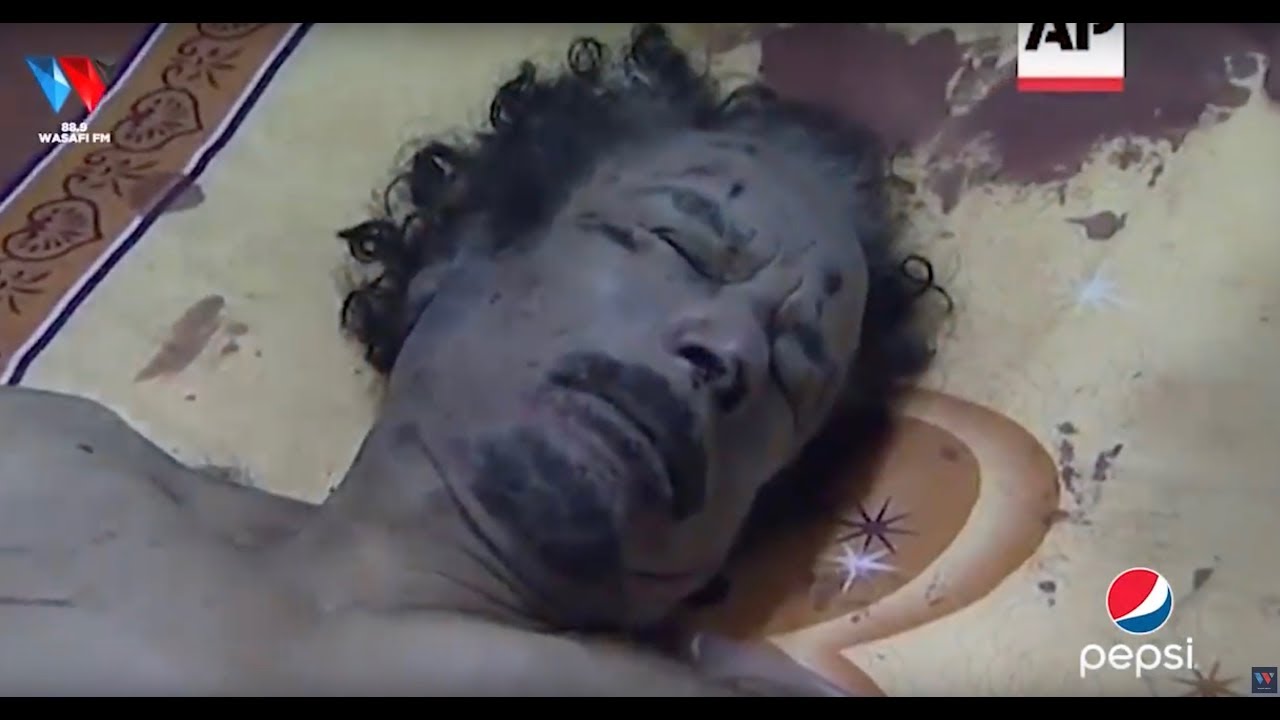 MUAMMAR GADDAFI: RAIS ALIYEVULIWA NGUO NA KUBURUZWA BARABARANI/ MWILI WAKE KUKAA BUCHANI HADI KUOZA