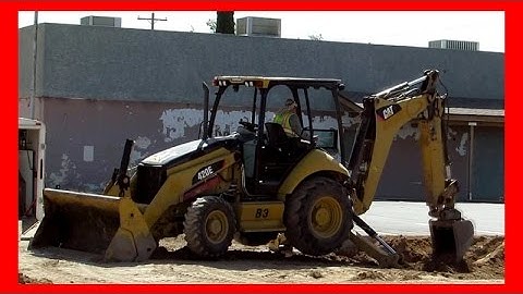 CAT 420E backhoe working the dirt