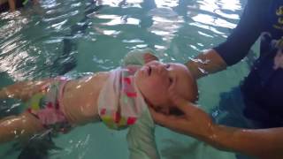 Baby learns how to float on back