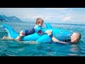 Baby Shark - Kid&#39;s Songs and Nursery Rhymes with Inflatable Toy &amp; Swimming Children at the seaside